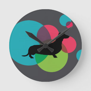 Black dachshund with bright dot pattern round clock