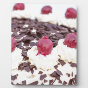 Black Forest cake in detail with white background Plaque