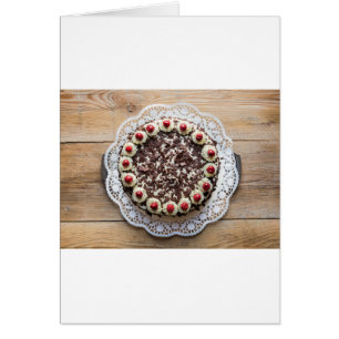 Black Forest cake on rustic wood