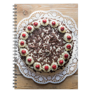 Black Forest cake on rustic wood Notebook