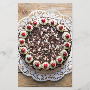 Black Forest cake on rustic wood Stationery