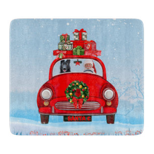 Black German Shepherd Dog In Car With Santa Claus Cutting Board