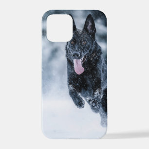 Black German Shepherd in snow Duvet Cover