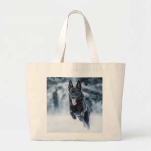 Black German Shepherd in snow Duvet Cover Large Tote Bag