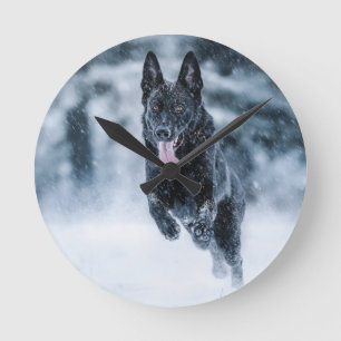Black German Shepherd in snow Duvet Cover Round Clock