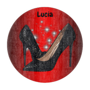 Black Glitter High Heel Shoe on Red Cutting Board