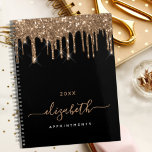 Black gold drips monogram name 2025 planner<br><div class="desc">An elegant black background with drips, paint dripping look. Personalise and add a year, name and a title. The name is written with a golden large modern hand lettered style script. Perfect for school, work or organising your personal/family life. To keep the swashes only delete the sample name, leave the...</div>