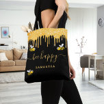 Black gold glitter bumblebees be happy name tote bag<br><div class="desc">Decorated with happy,  smiling bumblebees. A chic black background. Decorated with faux gold glitter drips. Yellow hand lettered script with swashes and the text: Bee Happy.  Personalise and add your name.</div>