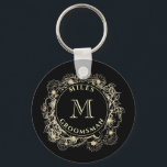 Black Gold Groomsman Monogram Keychain<br><div class="desc">This custom keychain makes a classy and personal groomsman gift,  featuring a gold floral crest with your monogram on a sleek black background. A small but thoughtful keepsake they’ll carry with pride.
Need help adjusting names or initials? Reach me anytime at bpkolman@gmail.com</div>