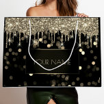 Black Gold Minimal Name Luxury Branding Drips Large Gift Bag<br><div class="desc">This stunning bag is the perfect choice for those who want to make a lasting impression with their gift-giving. Crafted from the finest materials, this gift bag exudes sophistication and elegance. The black and gold colour scheme is timeless and classic, while the minimal name branding drips add a touch of...</div>