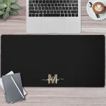 Black Gold Modern Minimalist Name Monogram Desk Mat<br><div class="desc">Personalised Initial Name Monogram Black and Gold Desk Mat. Add a personal and stylish touch to your workspace with this custom desk mat, perfect as an office accessory or oversized mouse pad. The design features a black background with a gold initial and white script name placed at the bottom centre...</div>