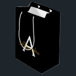 Black Gold Modern Script Girly Monogram Name Medium Gift Bag<br><div class="desc">Black and Gold Simple Script Monogram Name Gift Bag. This makes the perfect sweet 16 birthday,  wedding,  bridal shower,  anniversary,  baby shower or bachelorette party gift bag for someone that loves glam luxury and chic styles.</div>