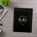 Black gold monogram initials name minimalist 2025 planner<br><div class="desc">Black background,  golden and white text. Personalize and add your name,  monogram initials,  and year. (any year) golden and white letters.  The name is written with a hand lettered style script.</div>