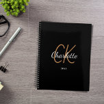 Black gold monogram initials name minimalist 2026 planner<br><div class="desc">Black background,  golden and white text. Personalize and add your name,  monogram initials,  and year. (any year) golden and white letters.  The name is written with a hand lettered style script.</div>