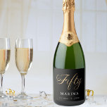 Black gold name script 50th birthday sparkling wine label<br><div class="desc">Fifty written with a faux gold script.  Personalise and add a name and date.  White text.</div>