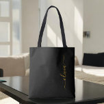 Black Gold Name White Girly Script Monogram Modern Tote Bag<br><div class="desc">Black and Gold Elegant Add Your Own Name Monogram Book Bag. This Book Bag can be customised to include your initial and first name and given as a gift for Christmas,  Sweet 16 Birthday,  Bridal Shower or a Wedding.</div>