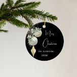 Black gold white baubles Christmas Ceramic Ornament<br><div class="desc">An elegant,  modern black background. Decorated with white and gold baubles and some greenery and a pine cone.  Personalise and add your name,  year.  Text: Merry Christmas</div>