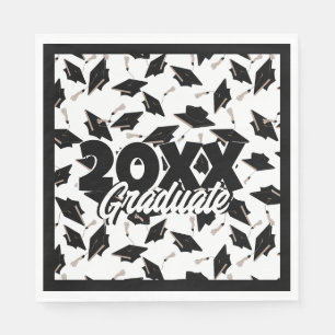 Black Graduation Caps Tossed in the Air on White Napkin