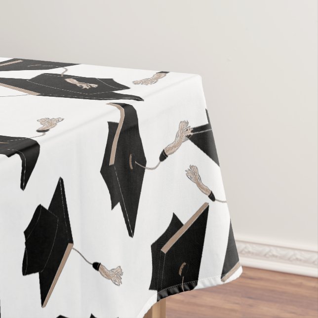 Black Graduation Caps Tossed in the Air on White Tablecloth (In Situ)