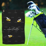 Black happy bumble bees summer fun humour monogram golf towel<br><div class="desc">Decorated with happy, smiling yellow and black bumble bees. A chic black background. Personalise and add a name and your monogram, initials. The monogram in grey as a pattern in the background. The name is written in white with a modern hand lettered stylie script with swashes. To keep the swashes...</div>