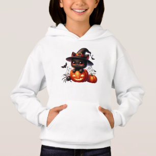 Black Kitten in a Halloween Pumpkin