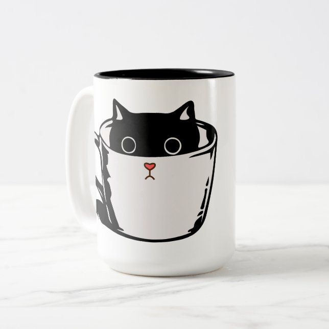 Black kitten with red nose hiding in a cup (Front Left)