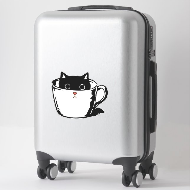 Black kitten with red nose hiding in a cup (Suitcase)