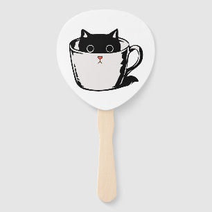 Black kitten with red nose hiding in a cup hand fan