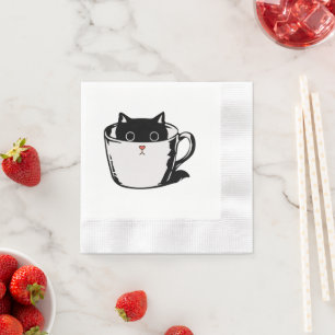 Black kitten with red nose hiding in a cup napkin