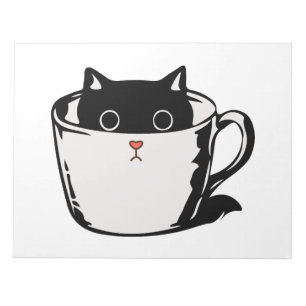 Black kitten with red nose hiding in a cup notepad