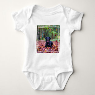 Black Labrador In Fall Leaves Baby Bodysuit