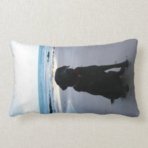 Black Labrador on a beach Lumbar Cushion