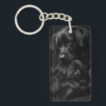 Black Labrador, parent and child, Hug of love Key Ring<br><div class="desc">A beautiful image of a parent and child pair of black Labrador Retrievers snuggling together in a loving bond. This touching image captures the tender connection between a parent and their black Labrador puppy, as they snuggle together in a beautiful display of love and affection. It's a heartwarming reminder of...</div>