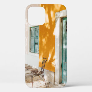 Black metal chair near dor iPhone 12 case