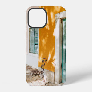 Black metal chair near dor iPhone 12 case