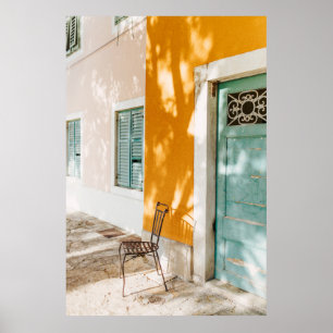 Black metal chair near dor poster
