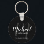 Black Modern Script Personalised Groomsmen Key Ring<br><div class="desc">Add a personal touch to your wedding with personalised groomsmen keychain. This keychain features personalised groomsmen's name in white modern script font style and monogram in grey modern script font style as background with title and wedding date in white modern sans serif font style on black background. Also perfect for...</div>