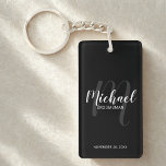 Black Modern Script Personalised Groomsmen Key Ring<br><div class="desc">Add a personal touch to your wedding with personalised groomsmen keychain. This keychain features personalised groomsmen's name in white modern script font style and monogram in light grey modern script font style as background with title and wedding date in white modern sans serif font style on black background. Also perfect...</div>