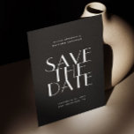 Black Modern Wedding | Contemporary Photo & QR Save The Date<br><div class="desc">Make a striking first impression with this black save the date wedding card, designed for couples who love modern simplicity with a dramatic edge. The front features bold, minimalist typography against a deep black background, creating a refined and contemporary look that immediately sets the tone for your celebration. The back...</div>
