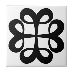Black ornament design on white tile
