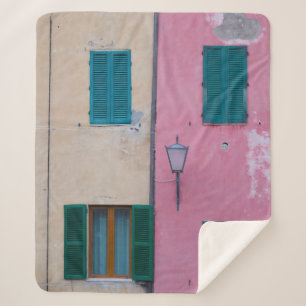 BLACK OUTDOOR SCONCE ON PINK PAINTED WALL SHERPA BLANKET