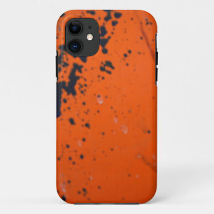 Black paint splatter on orange iPhone 11 case
