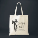 Black Pink Bow She's Tying the Knot Bridal Shower  Tote Bag<br><div class="desc">Add a stylish touch to your bridal shower with our Black Pink Bow She's Tying the Knot Bridal Shower Tote Bag! Featuring a chic black design with a feminine pink bow, this tote bag is perfect for carrying favours, gifts, or essentials for the special day. It's an elegant and practical...</div>