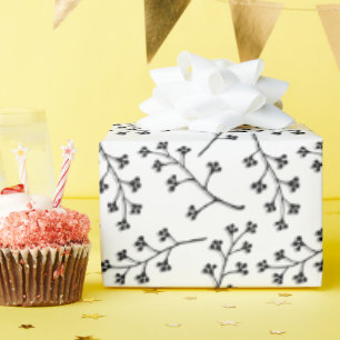 black plant twig on white wrapping paper