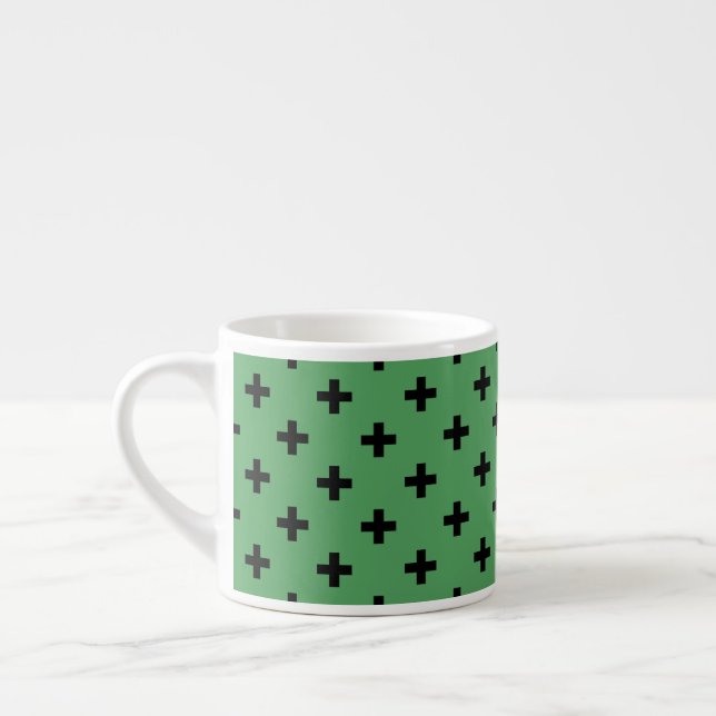 Black polka crosses on green espresso cup (Left)