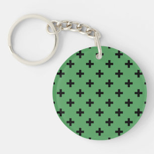 Black polka crosses on green key ring