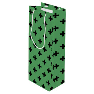 Black polka crosses on green wine gift bag
