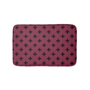 Black polka crosses on mulberry bath mat