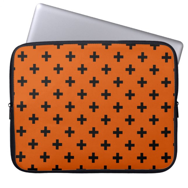 Black polka crosses on orange laptop sleeve (Front)