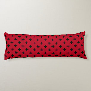 Black polka crosses on red body cushion